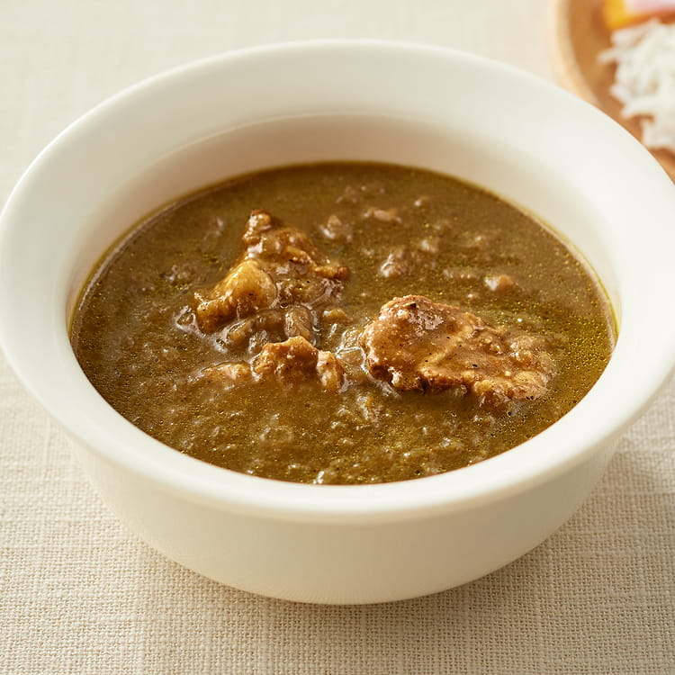 器によそった現地に学ぶ　スリランカ　豚肉とタマリンドのスパイシーカレーのイメージの写真