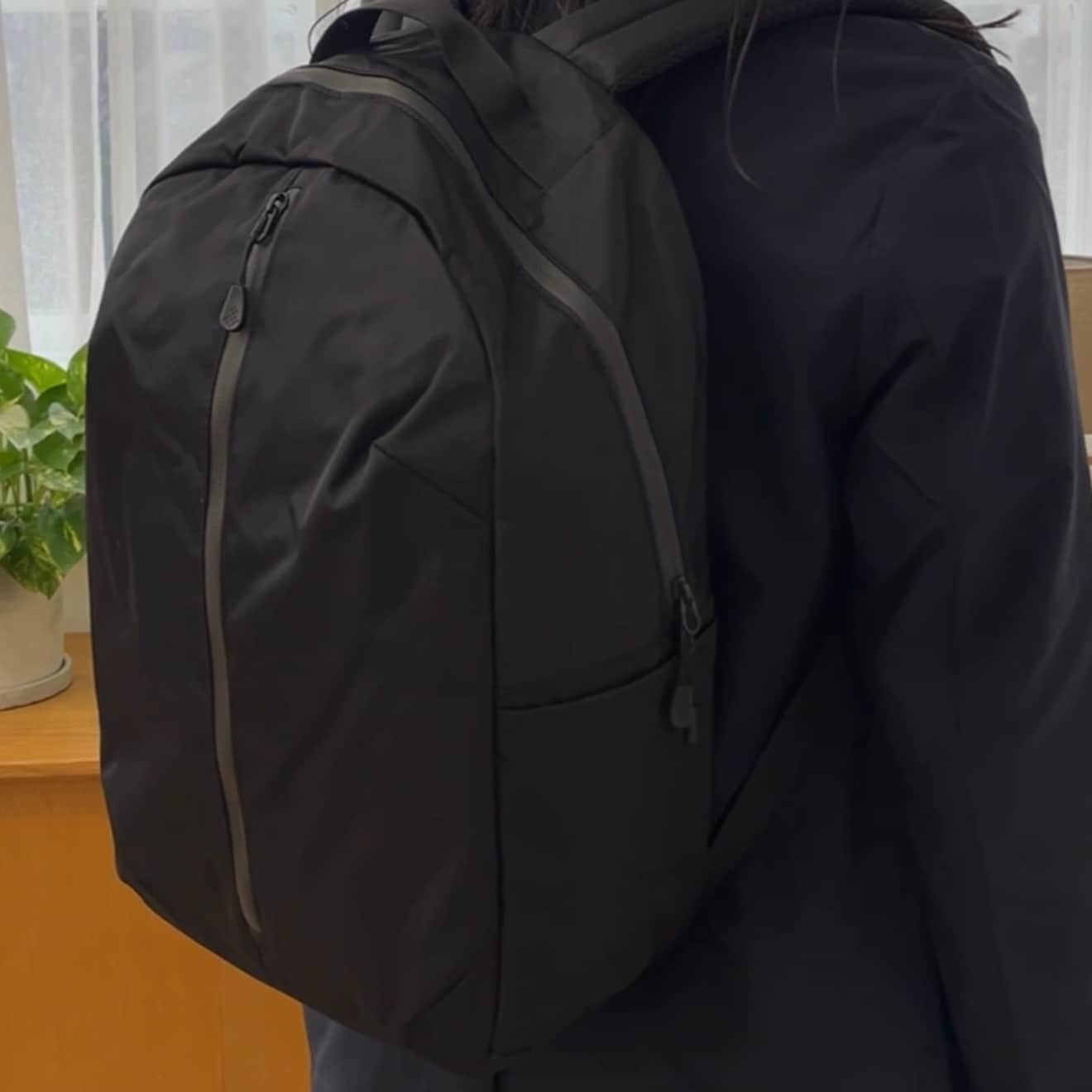無印良品の『肩の負担を軽くする 撥水 ビジネス リュックサック（丸型）』