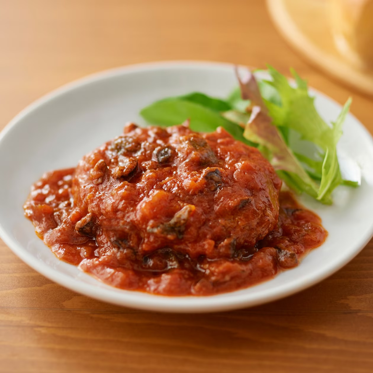 「素材を生かした　トマトの煮込みハンバーグ」の商品画像